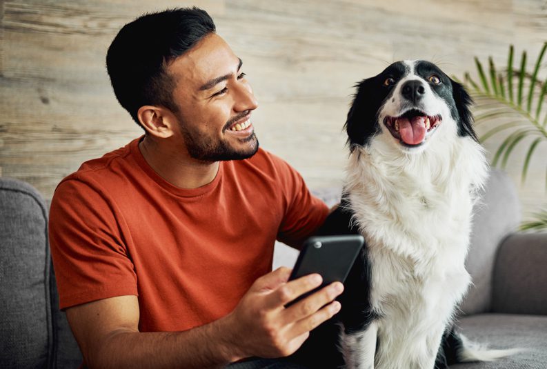 Parker-Heating-and-Air-Conditioning-smiling-man-with-dog-on-couch